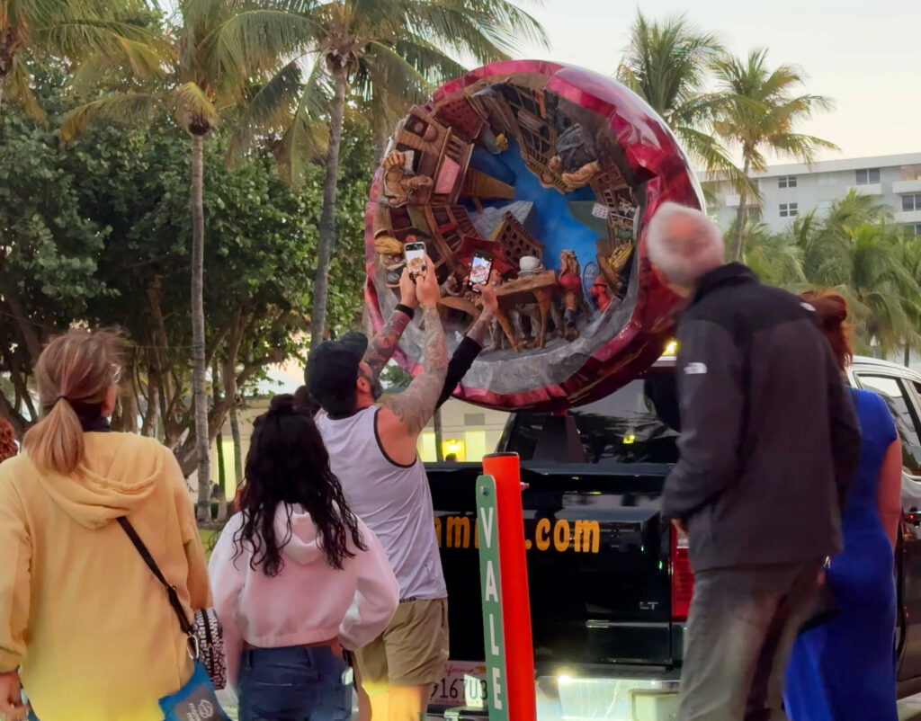 Big Red Ball sculpture by Paul Kamish displayed in Miami, Florida during Art Basel for Guerrilla Marketing