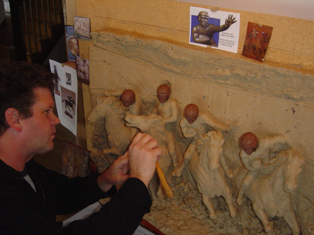 Home paul sculpting the four horsemen.jpg
