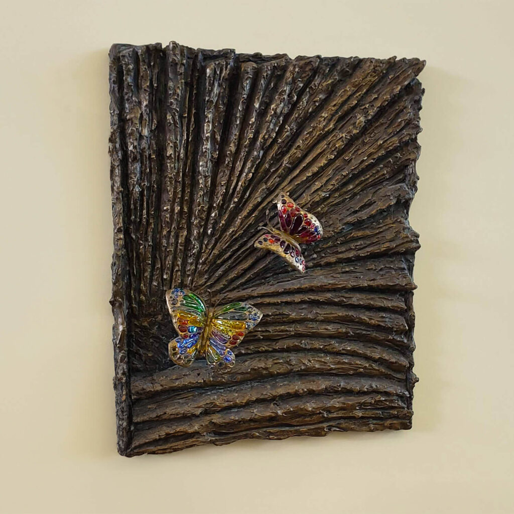 Bronze memorial sculpture with stained glass butterflies installed at New Prague Public Library, part of the Scott County Library System.