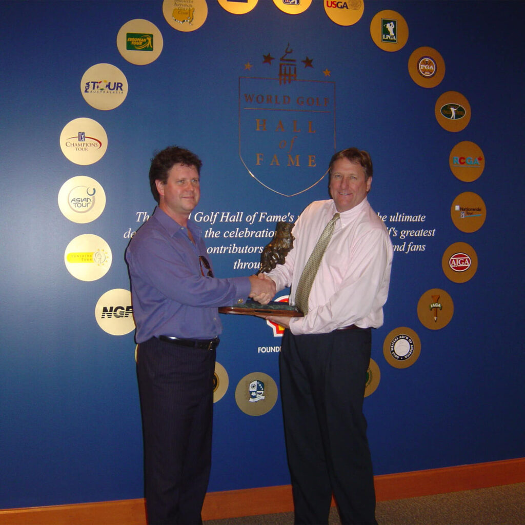 Artist Paul Kamish presenting a live cast of Sam Snead’s legendary grip to President Jack Peter at the World Golf Hall of Fame, where it will be displayed.