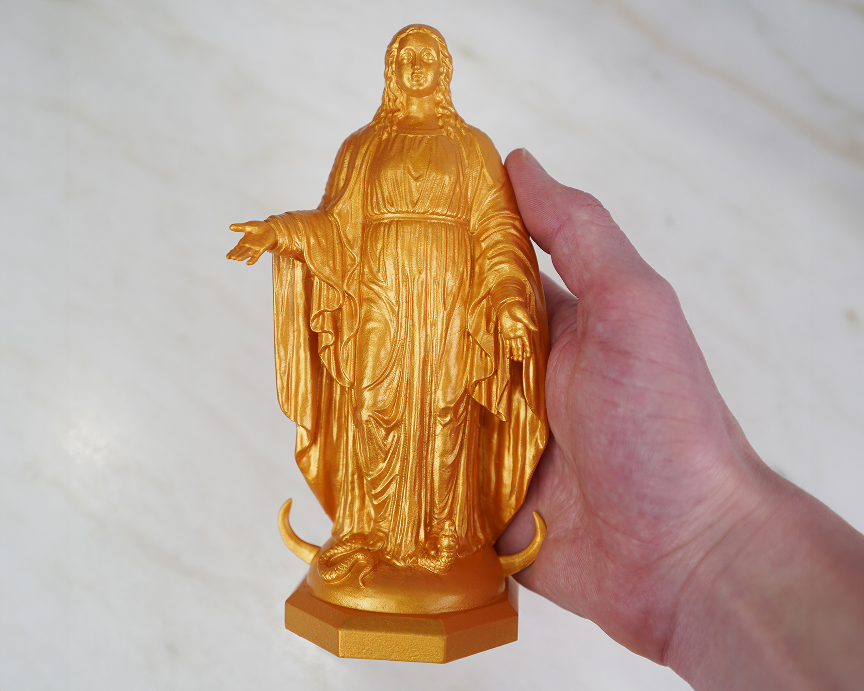 mini our mother in hand 1.jpg